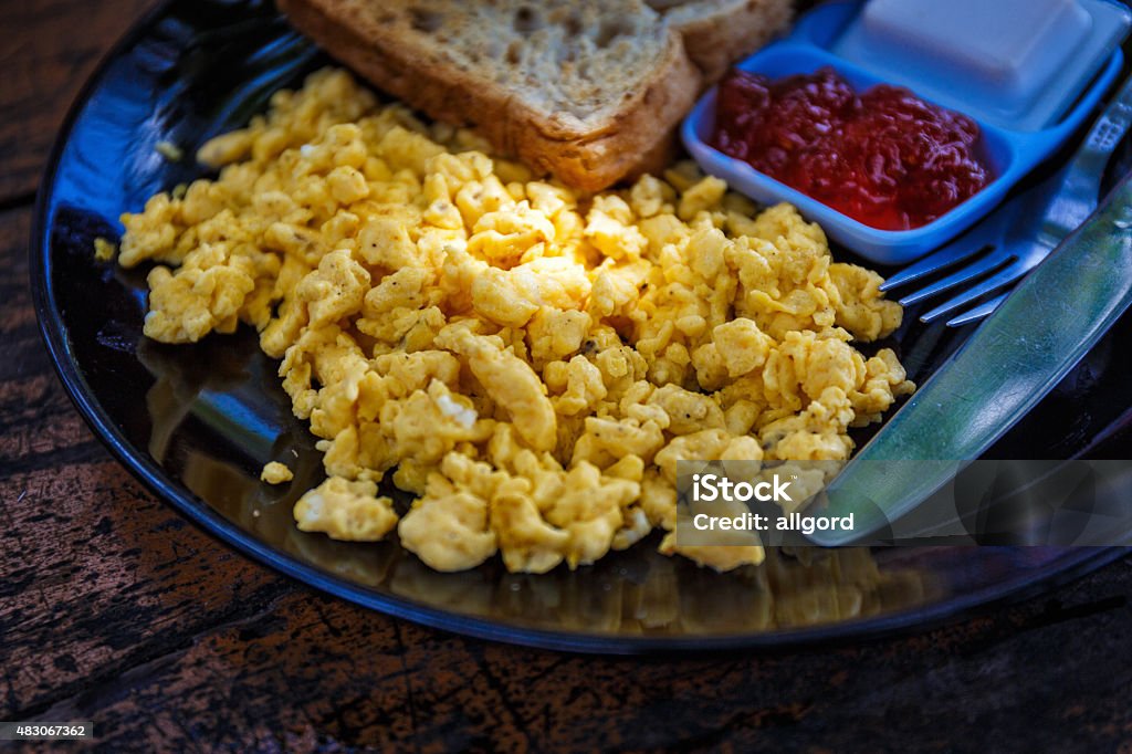 Omelet - breakfast Breakfast with scrambled eggs, toast and jam 2015 Stock Photo