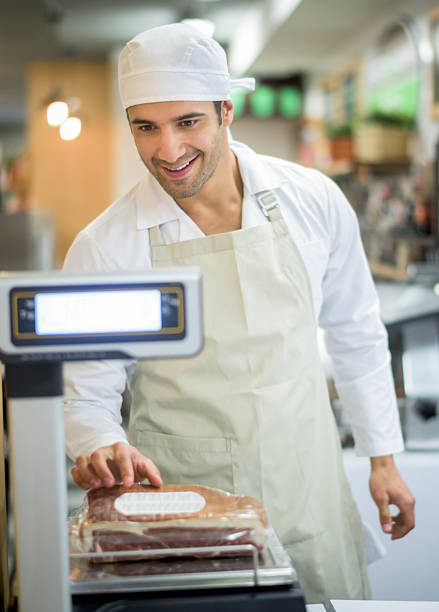 istock Man working at a butcher's shop 483067608