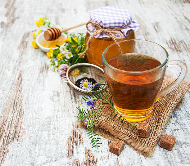 istock Cup of tea, honey and flowers 483069628