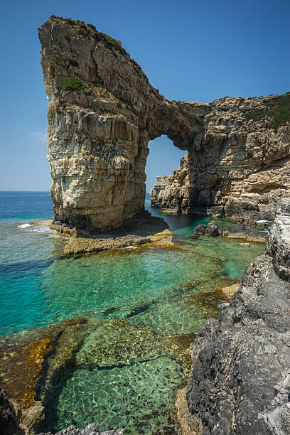 istock Unique and scenic arch in the cliffs, Paxi, Greece 483069834