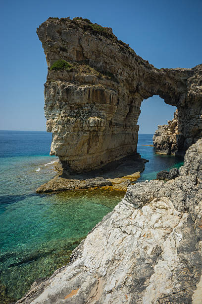 istock Unique and scenic arch in the cliffs, Paxi, Greece 483069840