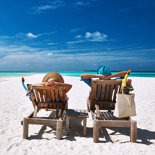 istock Couple relax on a beach at Maldives 483073531