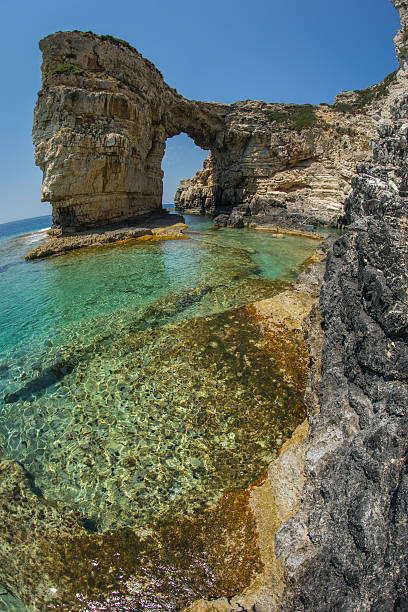 istock Unique and scenic arch in the cliffs, Paxi, Greece 483074280