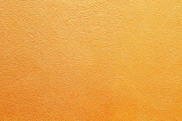 bunte betonwand - orange wall textured paint stock-fotos und bilder