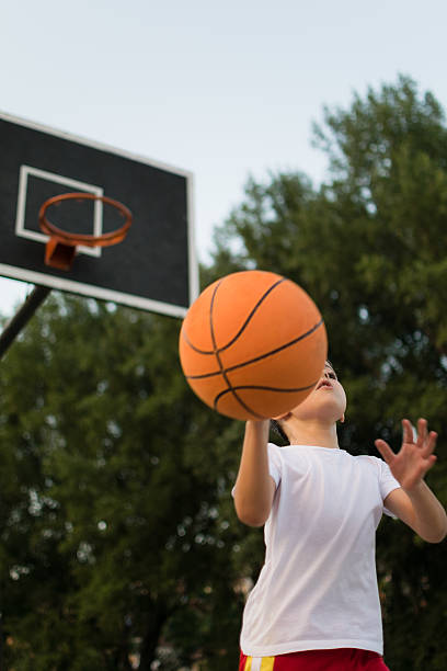 istock Father and son playing basketball 483075734