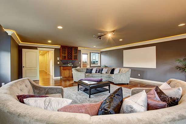 istock Large home theater living room with gray sofas. 483075774
