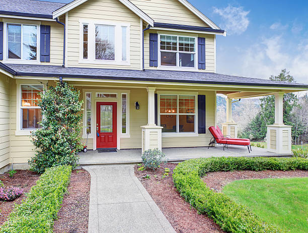 istock Classic American home with light yellow exterior. 483076260