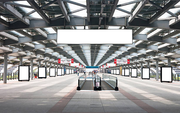 Blank billboard in passage Blank billboard in passage airport travelator stock pictures, royalty-free photos & images