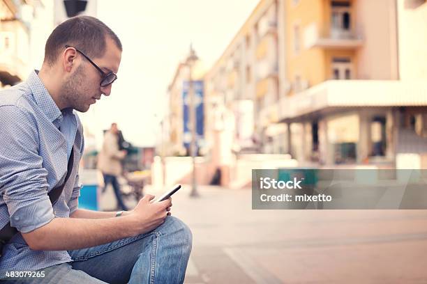Young Man Using Smartphone Of Street Stock Photo - Download Image Now - 25-29 Years, Adult, Adults Only