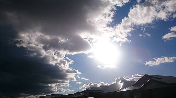 istock Contrast storm cloud meeting sunny sky. 483079848