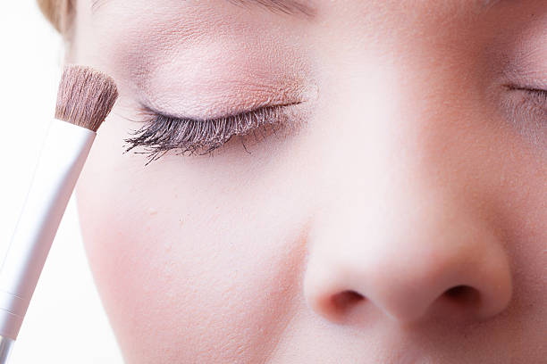 istock Part of face female eye makeup applying with brush 483079891