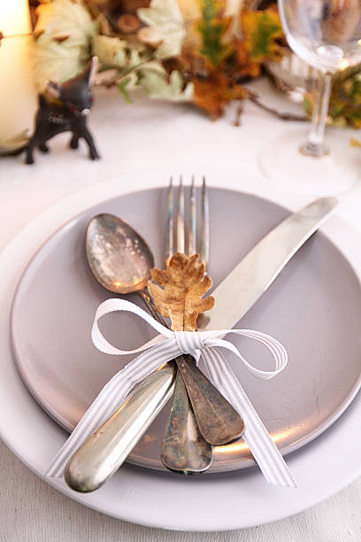 istock Table setting with dry leaves candles and vintage silverware 483079963