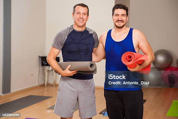 Male Friends Ready For Yoga Class Stock Photo - Download Image Now - Gym, Male Friendship, Exercising