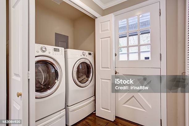 Small Laundry Area With Washer And Dryer Stock Photo - Download Image Now - Utility Room, Domestic Room, 2015