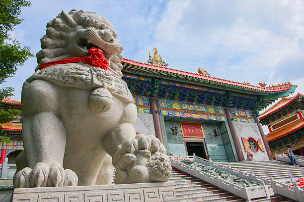 istock lion stepping world as stone statue perspective 483088890