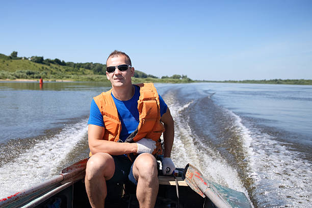 istock man in  life jacket on boat is moving quickly 483092428
