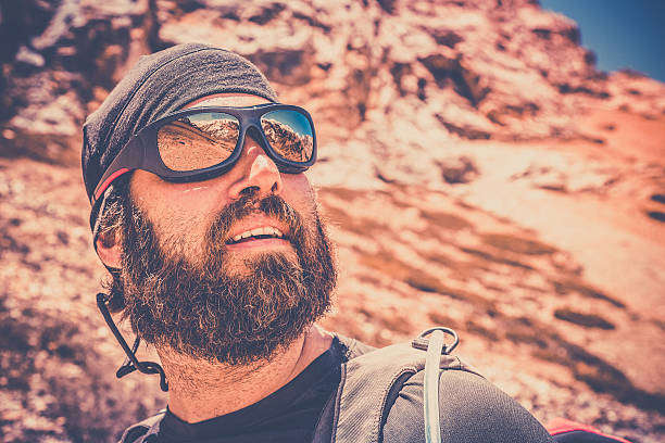 istock Man Hiker Wearing Sunglasses on Mountain Summit 483093233