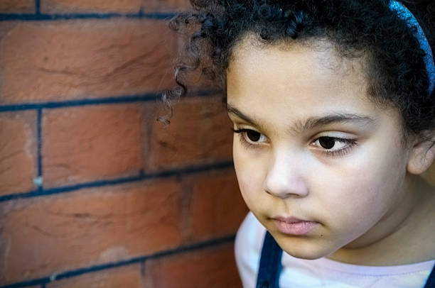 istock PEOPLE: Close Up Portrait Of Child (7-8) Looking Pensive 483094049