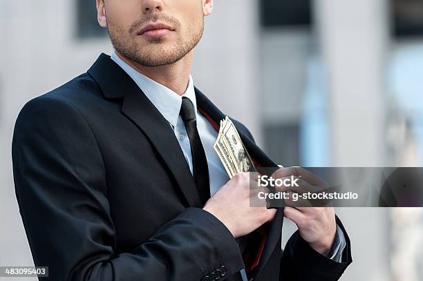 Pocketing Company Money Stock Photo - Download Image Now - Embezzlement, Business, Stealing - Crime