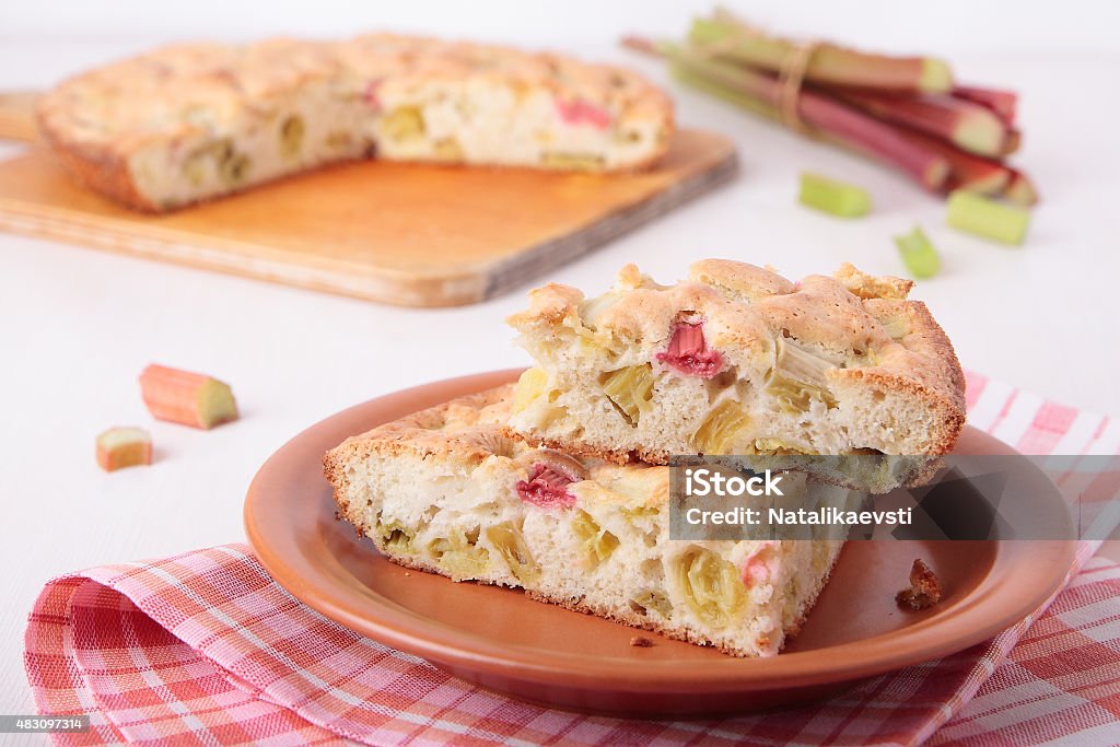 Two pieces of biscuit cake with rhubarb Two pieces of biscuit cake with rhubarb on a plate Cake Stock Photo