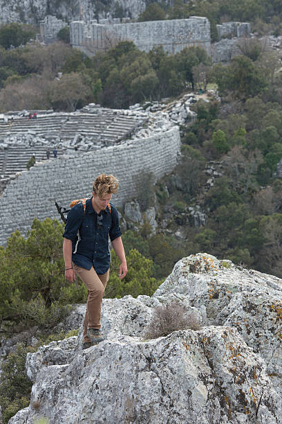 istock Young man hiking above theatre, ancient Greek ruin 483098314