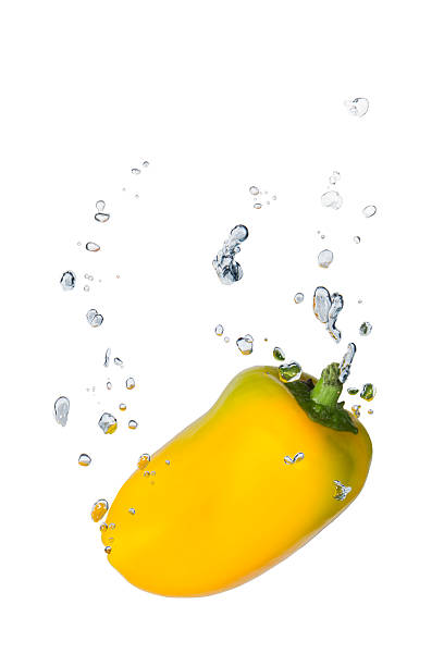 istock Yellow capsicum in water with air bubbles 483099683