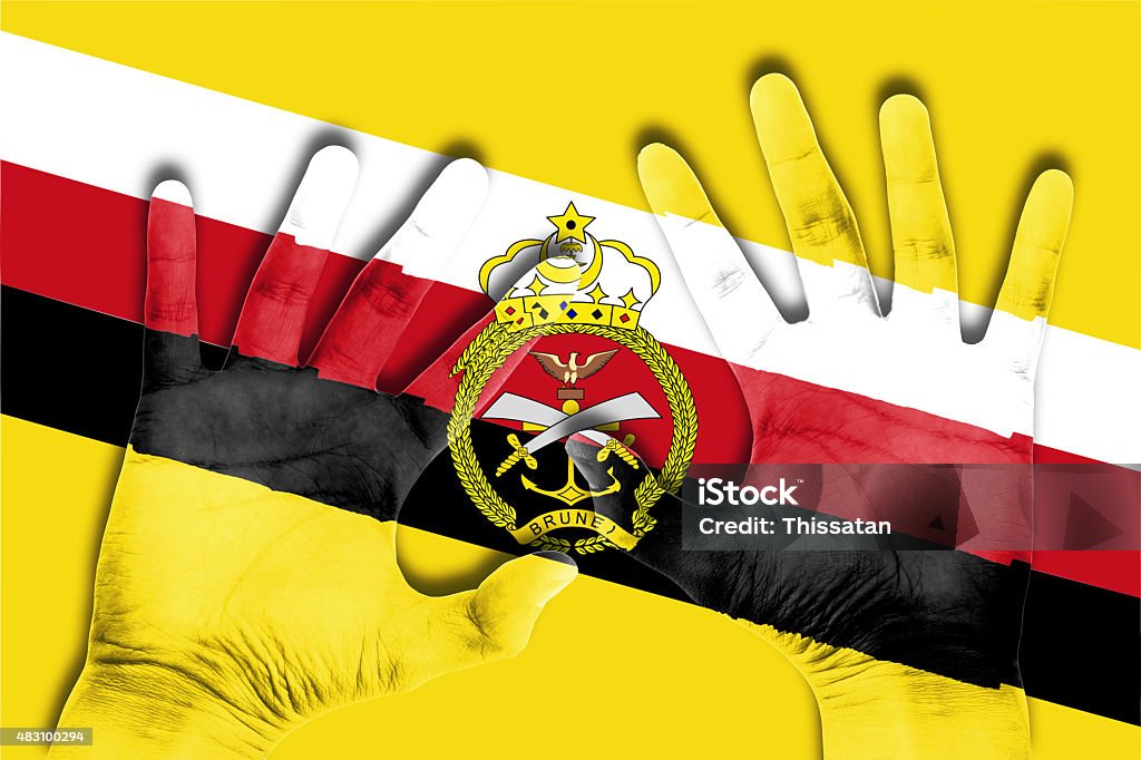 hands on brunei flag background 2015 Stock Photo