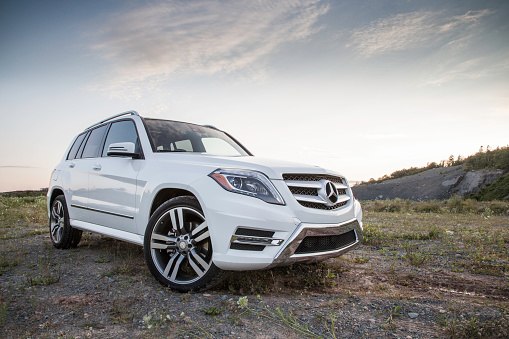 Dartmouth, Nova Scotia, Canada - August 1, 2015: Mercedes GLK250 parked on a dirt surface.  The Mercedes GLK250 BlueTEC turbodiesel is a luxury crossover that is rated at 200-hp, with 369 lb-ft of torque. The first GLK series vehicle went on sale for the 2008 model year and continued to the 2015 model year.