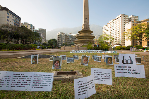 Caracas, Venezuela - April 20, 2015: Photos and messages protesting against the political regime in Venezuela laying on the grass plaza de Francia, Caracas. Venezuela 2015