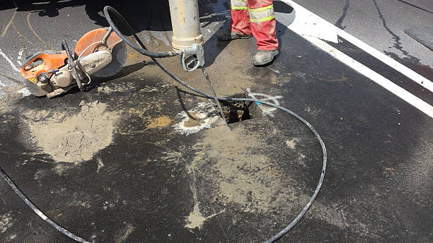 istock Cutting block of road asphalt with circular saw 483105778