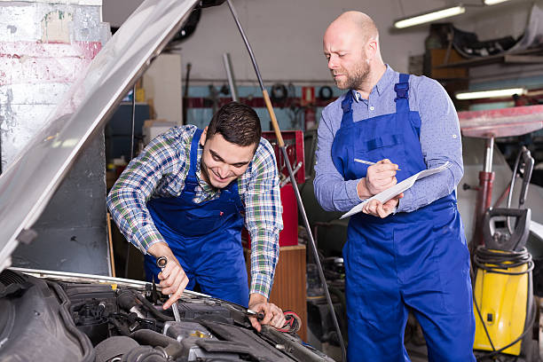 istock Mechanic calculating  price of work 483108670
