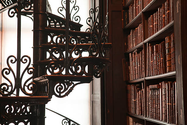 An old library full of old and rare texts with an old floor An old library full of old and rare texts trinity college library stock pictures, royalty-free photos & images