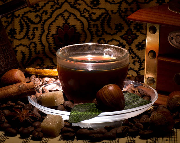 istock Cup of coffee on coffee beans and nut 483114897