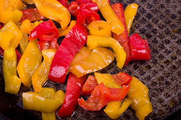 istock Tasty color peppers in frying pan 483115049