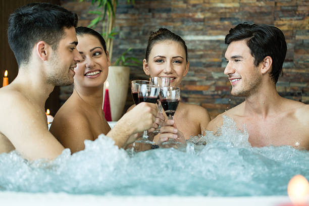istock Friends toasting in hot tub 483115415