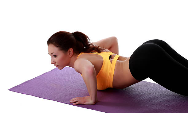 Attractive slim female model exercising