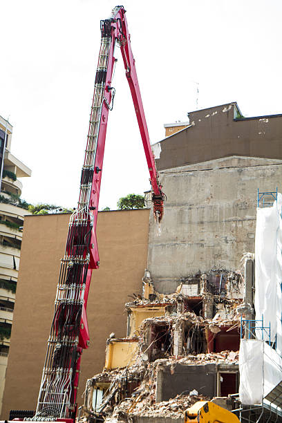 istock crane and digger working on building demolition 483116970