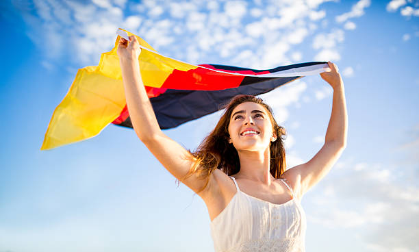 istock German flag being held by woman 483117659