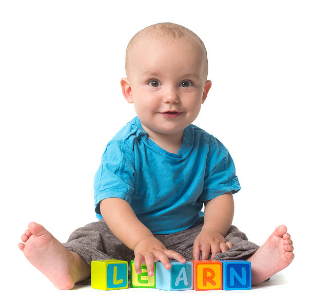 istock playing Baby in education log of woods learning 483117803