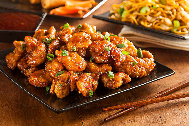 アジア oranage チキンのグリーンオニオン添え - chicken general tso food ストックフォトと画像