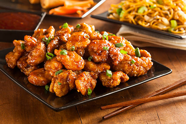 Asian Oranage Chicken with Green Onions Asian Oranage Chicken with Green Onions for Dinner chopsticks photos stock pictures, royalty-free photos & images