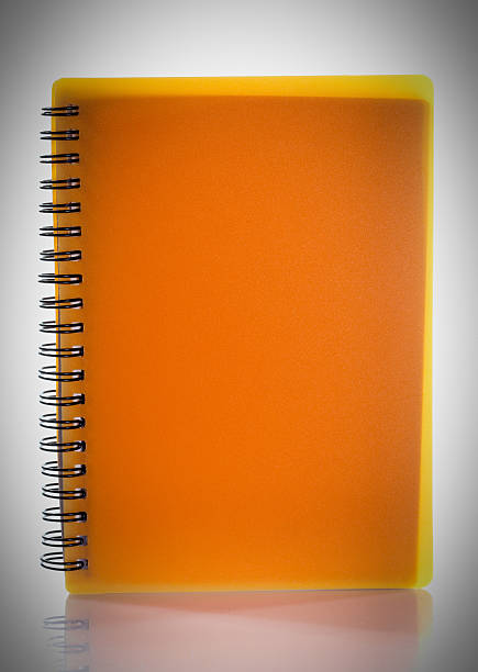 istock orange spiral book isolated on a white background 483120991