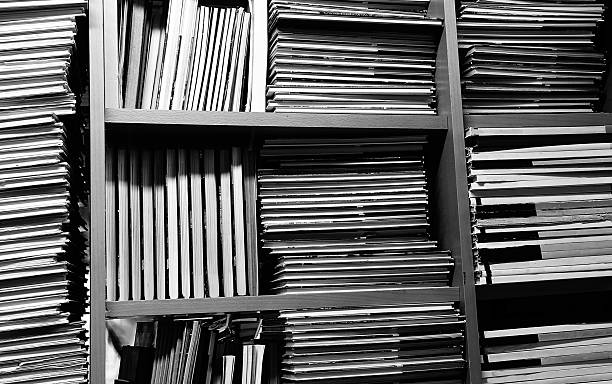 istock books piled up for sale in the great library 483121620