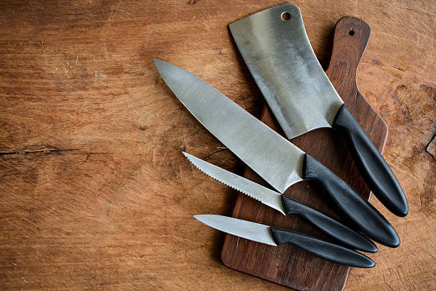 istock Set of kitchen knifes on wooden cutting board 483123906