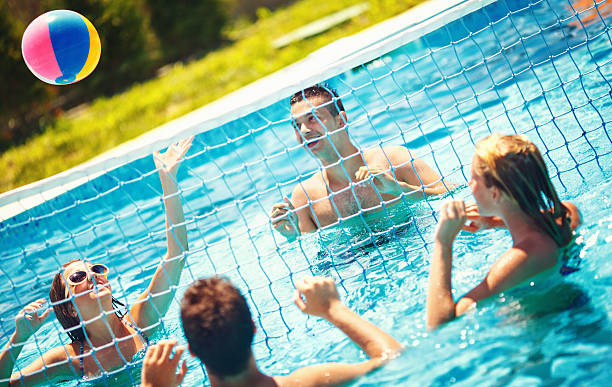 istock Friends playing volleybay in a pool. 483124796