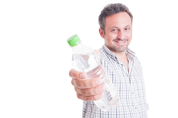 istock Man offering, giving a bottle of cold water 483127594