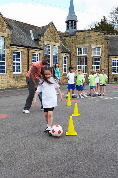 istock Group Of Children In School Physical Education Class 483127904