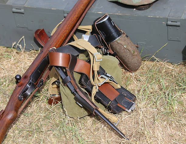 istock helmet of soldier uniform with a rifle 483128354