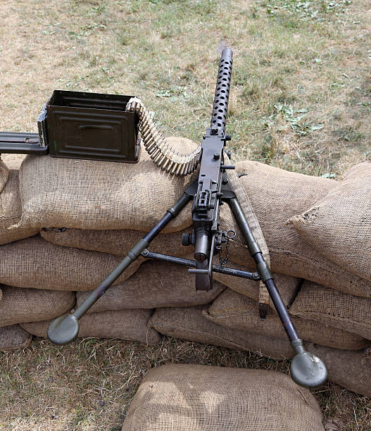 istock machine gun with bullets over the sandbags 483128360