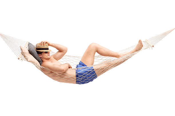 istock Shirtless young guy lying in a hammock and sleeping 483128552